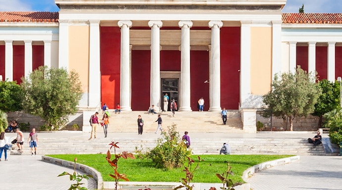 National Archaeological Museum entrance with columns and visitors in Athens, Greece.