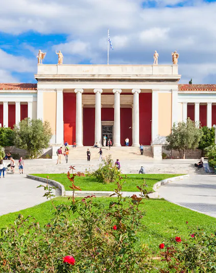 National Archaeological Museum entrance with columns and visitors in Athens, Greece.