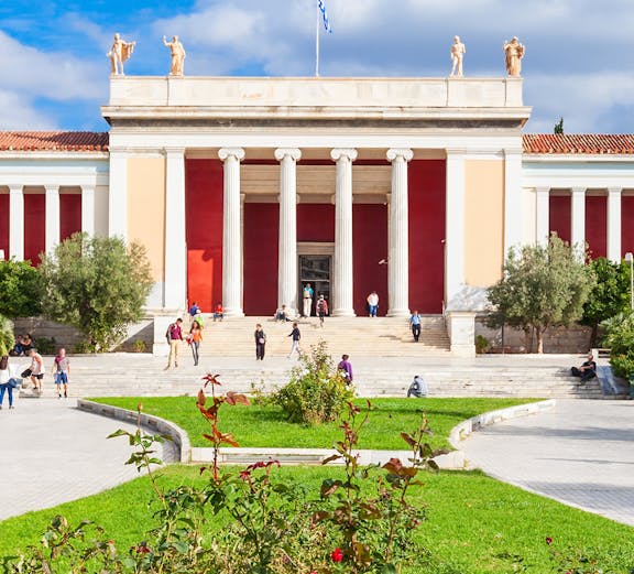 National Archaeological Museum entrance with columns and visitors in Athens, Greece.