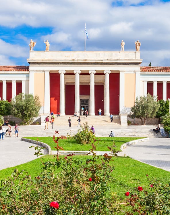 National Archaeological Museum entrance with columns and visitors in Athens, Greece.