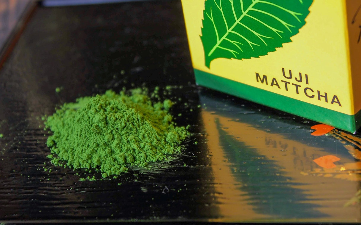 Uji matcha powder on a table, part of the Flower Teahouse tea ceremony in Kyoto.