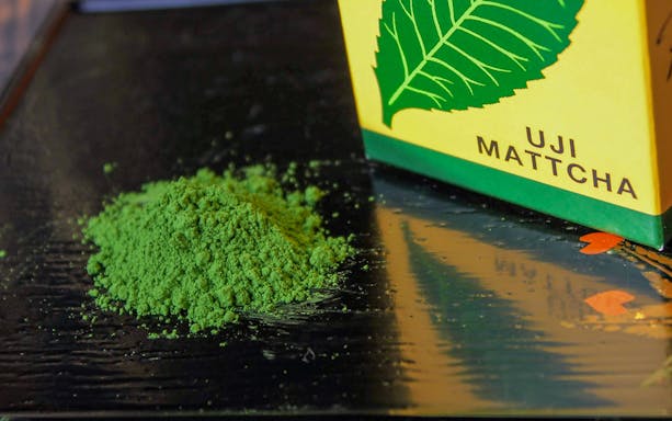 Uji matcha powder on a table, part of the Flower Teahouse tea ceremony in Kyoto.