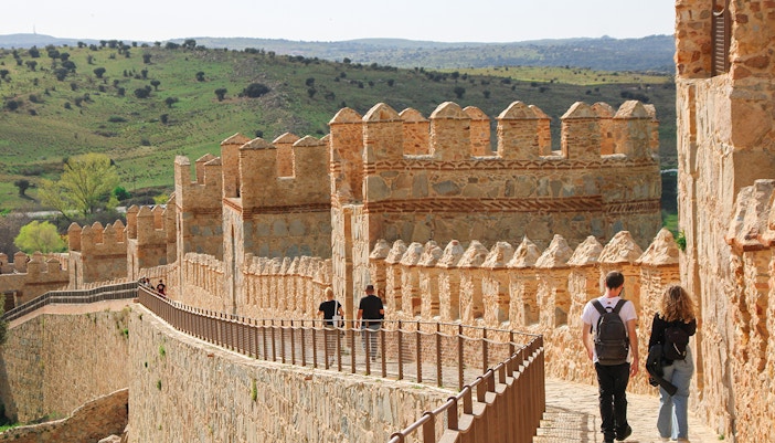 Visitors at the Avila Wall on a Madrid to Toledo, Segovia & Ávila Full-Day Tour