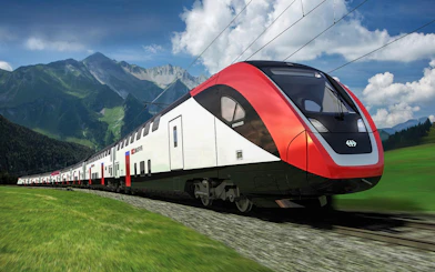 Train traveling from Zurich Airport to Zurich Central with mountains in the background.