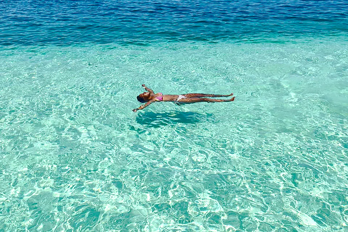 Floating in clear waters, Islas de San Blas, Panama.