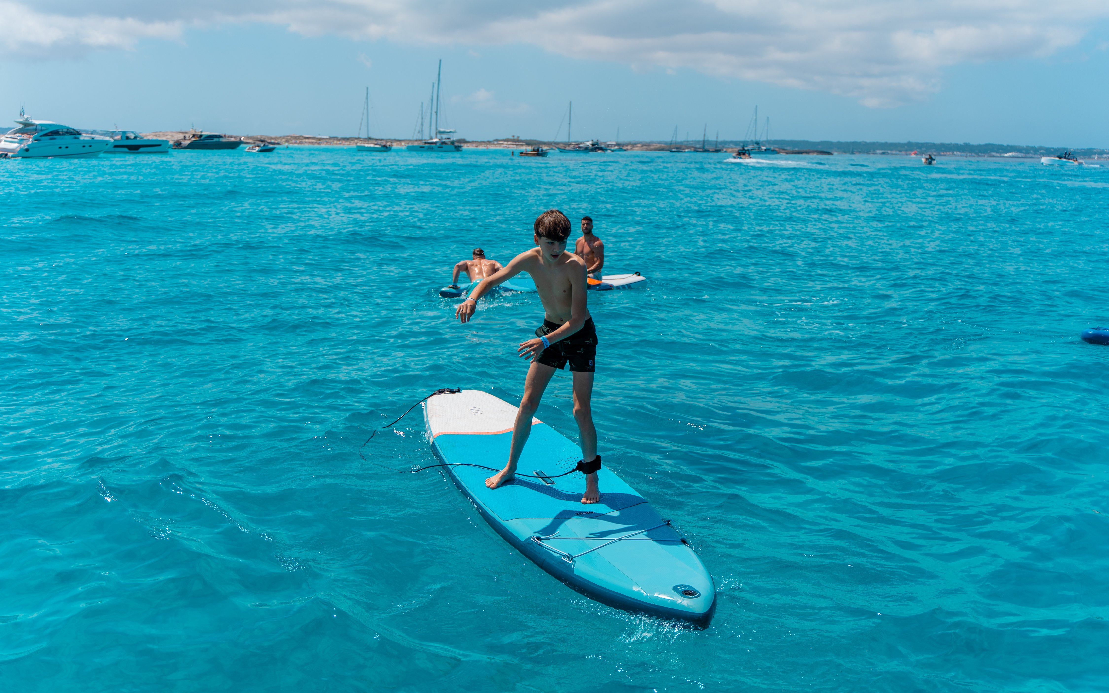 Paddleboarding on clear blue waters during Formentera Cruise Tour.