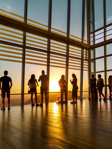 Visitors watching sunset from Sky Costanera observation deck, Santiago, Chile.