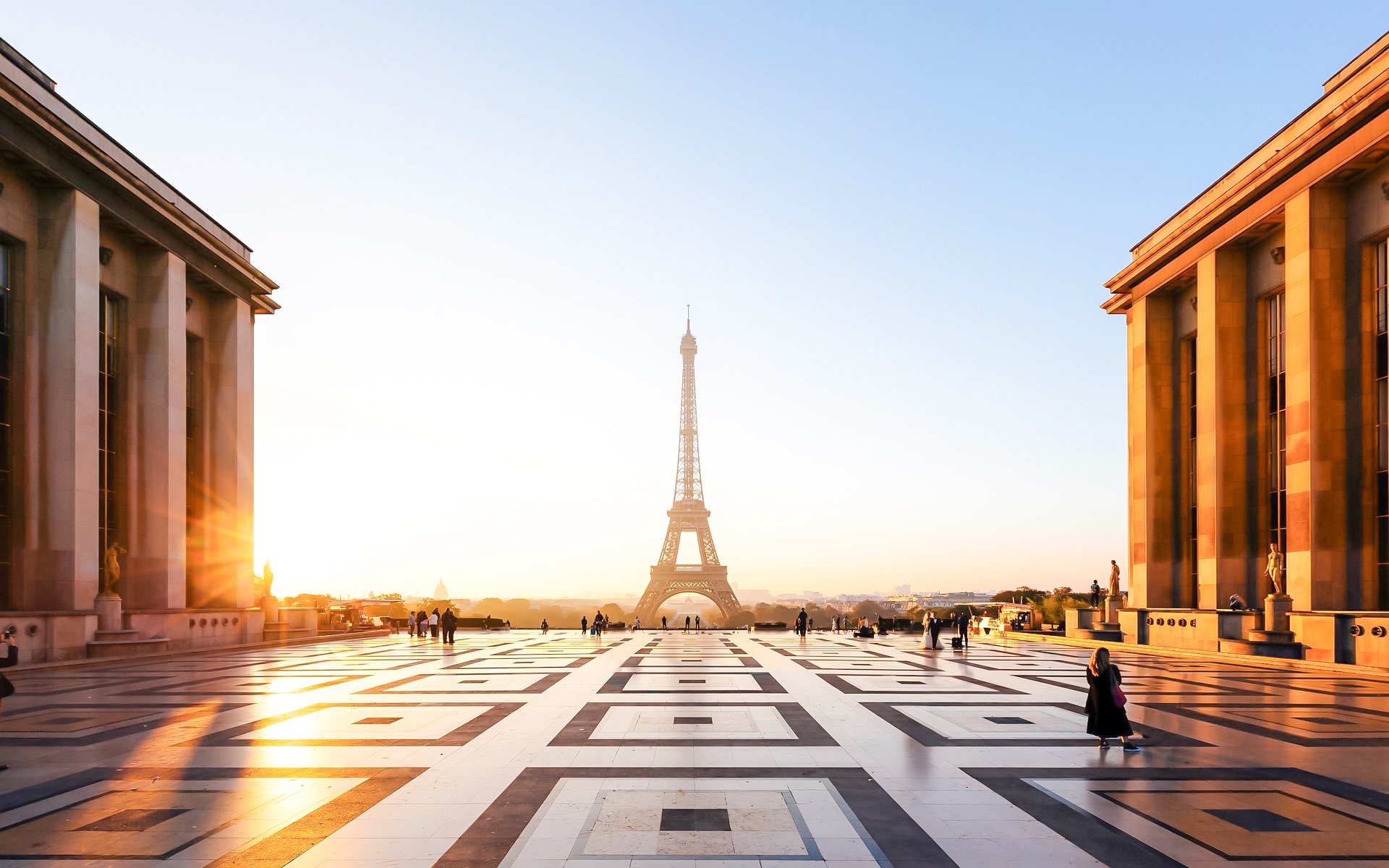 People on a guided Illumination Tour of Paris with Eiffel Tower at sunset.