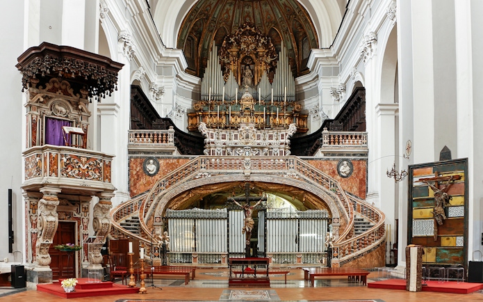 Interior of Basilica of Santa Maria della Sanita, featuring ornate altar and pulpit near Catacombs of San Gaudioso.