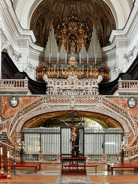 Interior of Basilica of Santa Maria della Sanita, featuring ornate altar and pulpit near Catacombs of San Gaudioso.