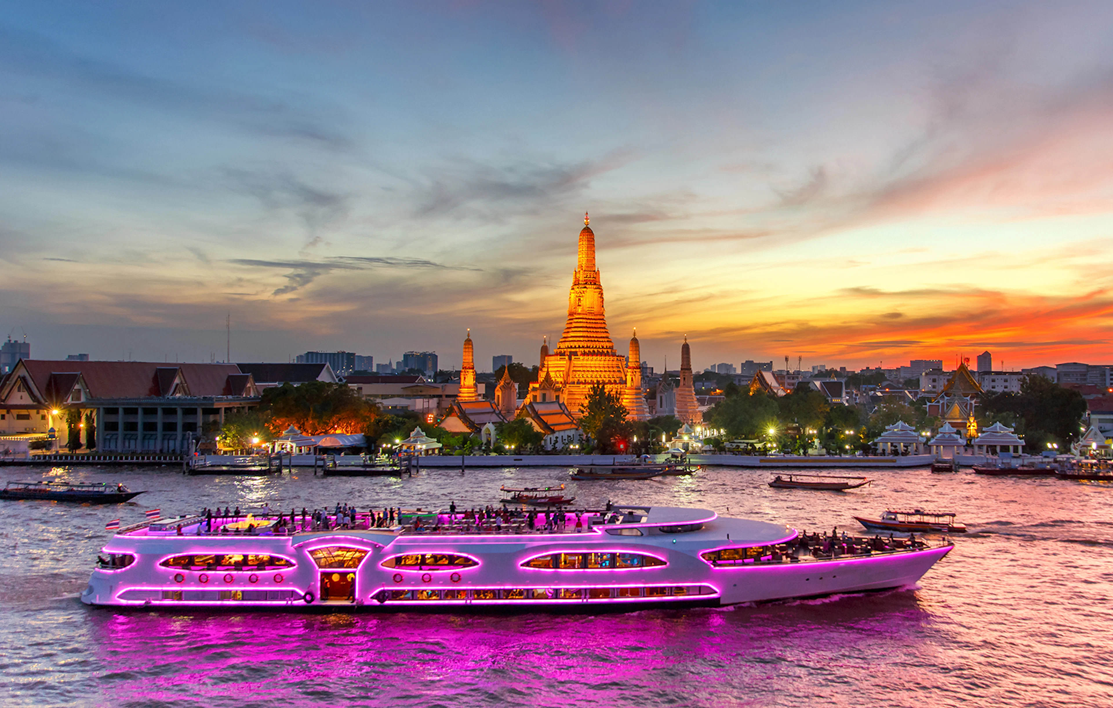 Chao Phraya Princess Cruise passing Wat Arun at sunset, Bangkok.
