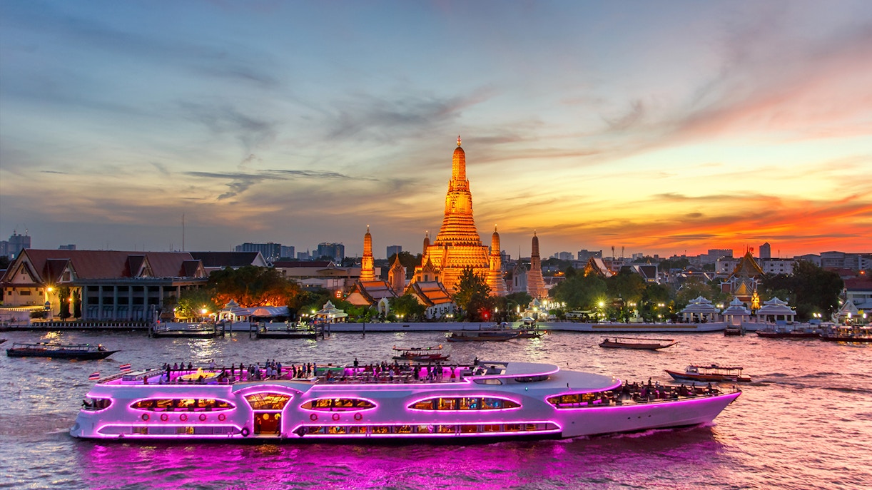Chao Phraya Princess Cruise passing Wat Arun at sunset, Bangkok.