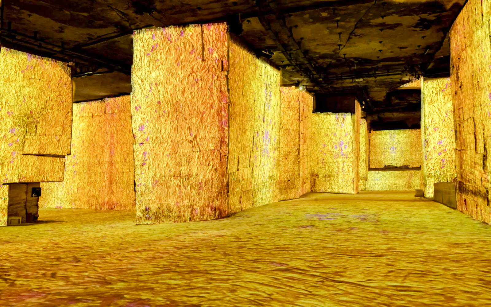 Carrières des Lumières illuminated quarry walls with vibrant projections.