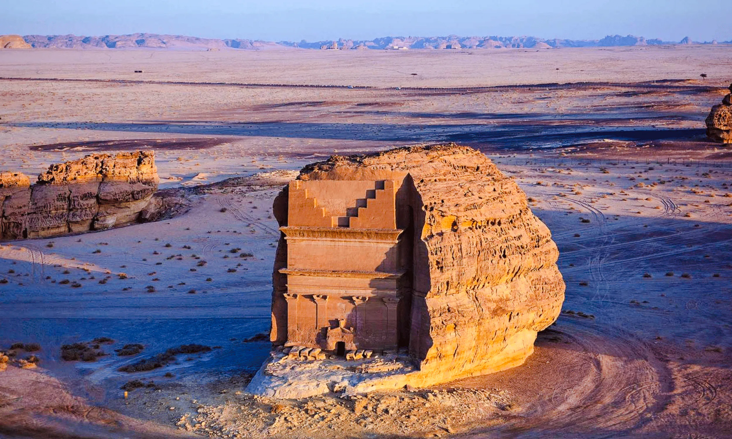 Hegra tomb in AlUla desert landscape, Saudi Arabia, viewed during a private day trip from Madinah.