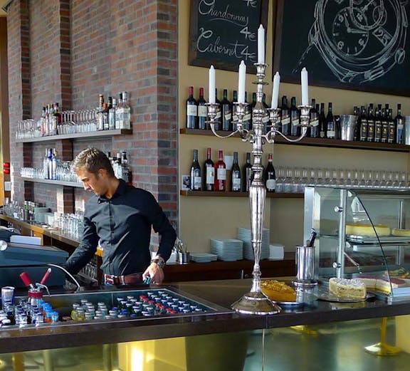 Bar area at Panoramapunkt Berlin with bartender preparing drinks.