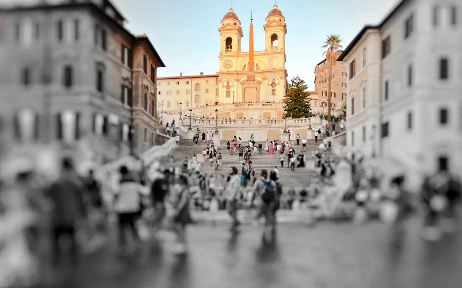 Crowds at the Spanish Steps with Trinità dei Monti church in Rome.