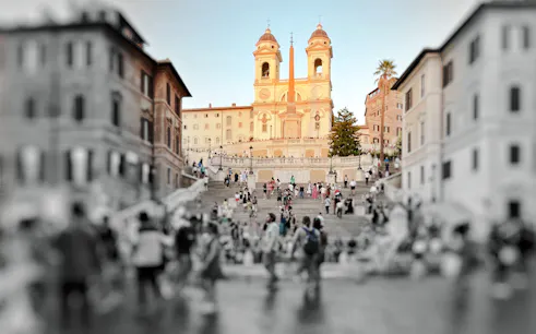 Crowds at the Spanish Steps with Trinità dei Monti church in Rome.
