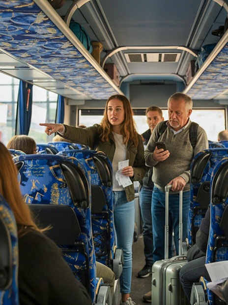 Guests on a coach transfer during Bovilla Lake and Gamti Mountain hiking tour.