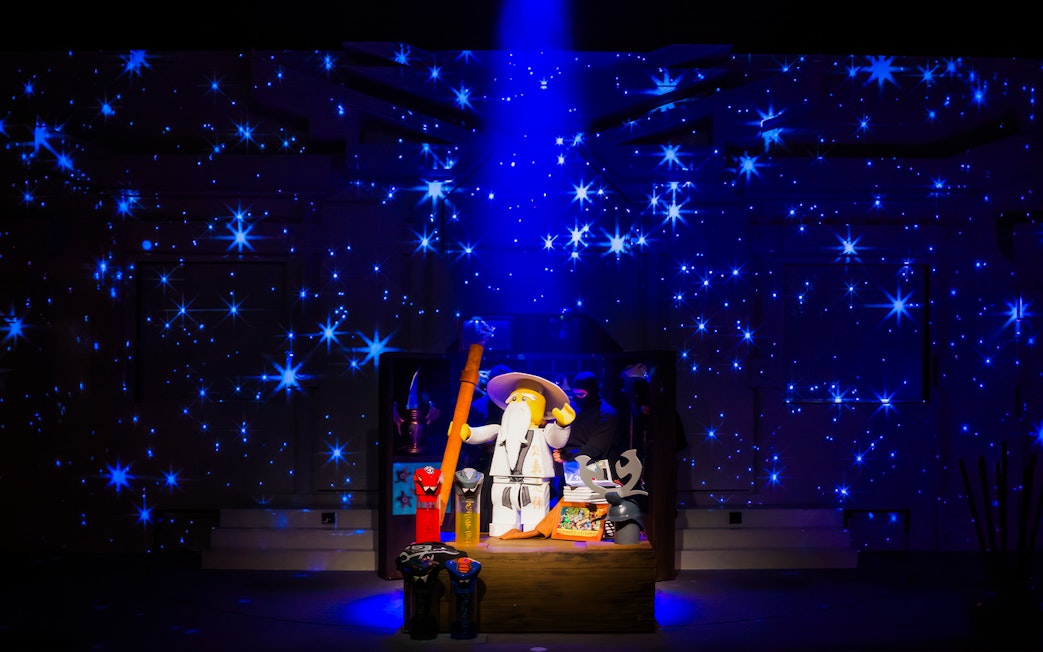 Lego wizard figure with staff surrounded by stars at Legoland Japan.