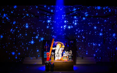 Lego wizard figure with staff surrounded by stars at Legoland Japan.