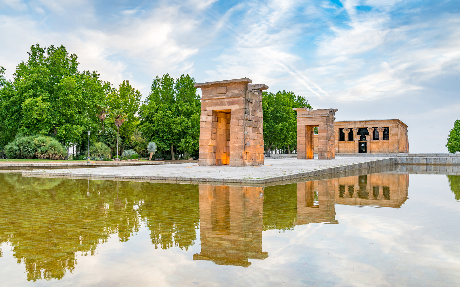 Temple of Debod in Madrid, Spain, reflected in a surrounding pool.