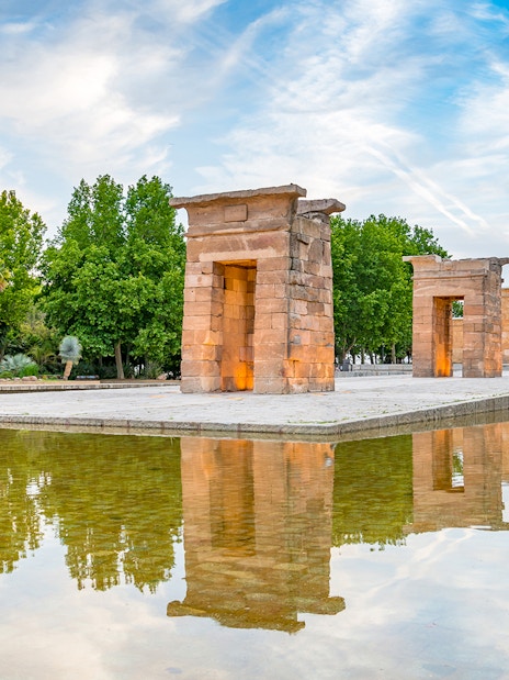 Temple of Debod in Madrid, Spain, reflected in a surrounding pool.