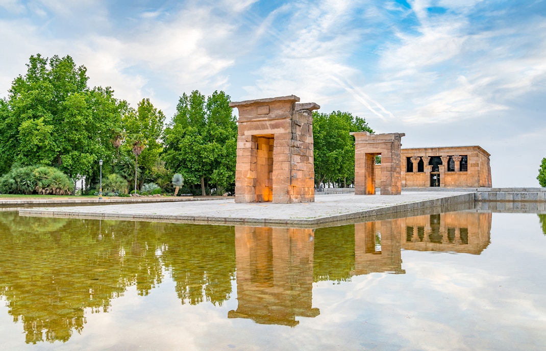 Temple of Debod in Madrid, Spain, reflected in a surrounding pool.