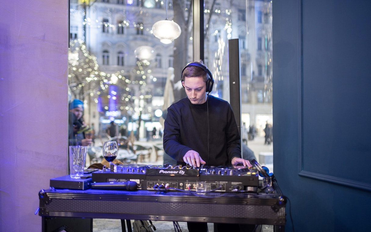 DJ performing at Czech tapas cuisine tasting tour with drinks in Prague.