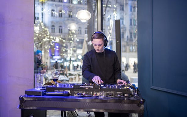 DJ performing at Czech tapas cuisine tasting tour with drinks in Prague.