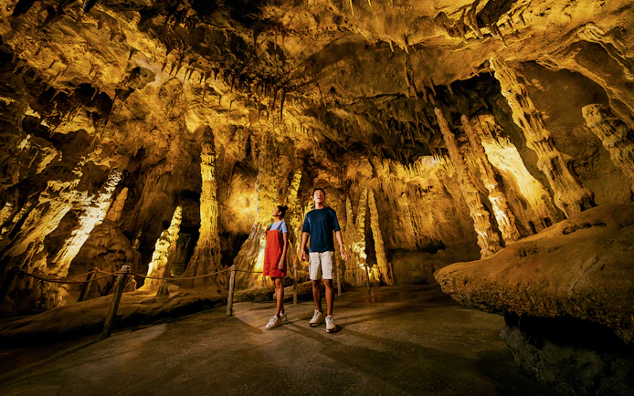 Visitors exploring stalactites and stalagmites in The Cavern, Drunken Forest.