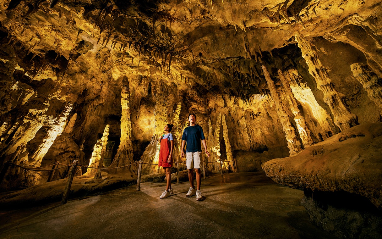 Visitors exploring stalactites and stalagmites in The Cavern, Drunken Forest.