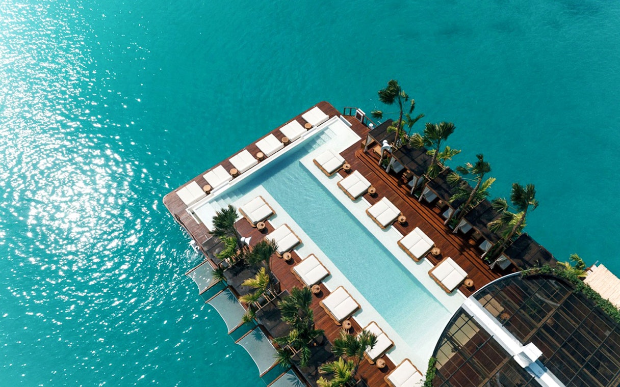 Aerial view of Yona Beach Club's pool and lounge area in Phuket.