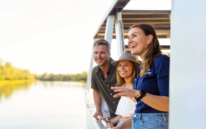 Tourists enjoying a boat ride on the Finniss River during the Top End Safari Camp Overnight Tour.