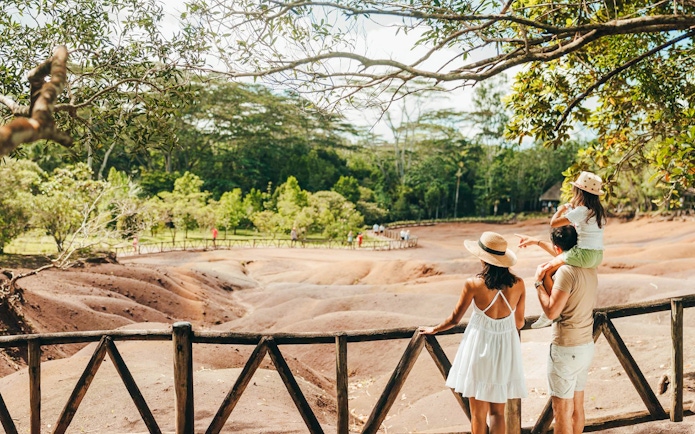 Visitors observing the Chamarel 7 Coloured Earth in Mauritius.
