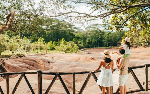 Visitors observing the Chamarel 7 Coloured Earth in Mauritius.