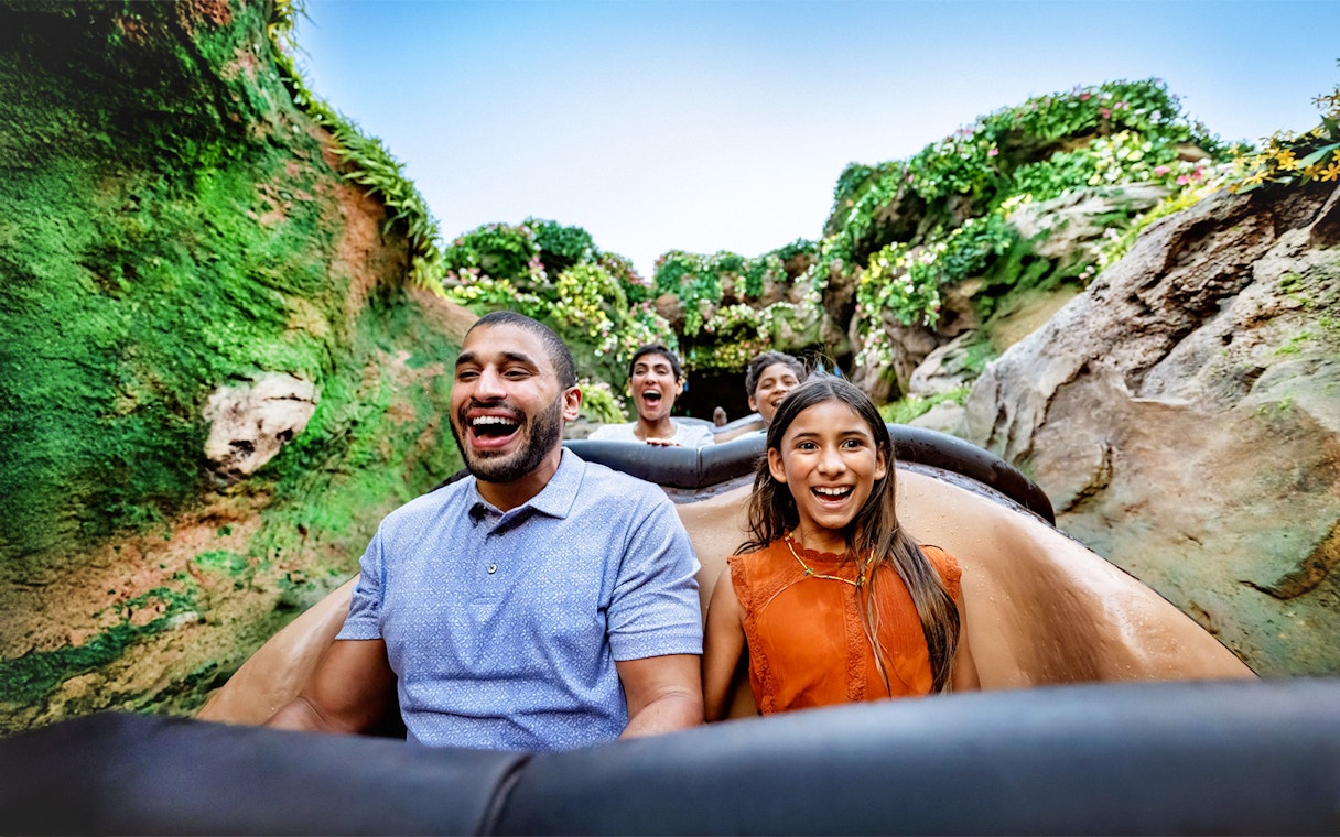 Guests enjoying a rollercoaster ride through lush jungle at Animal Kingdom, Walt Disney World, Orlando.