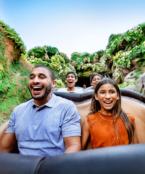 Guests enjoying a rollercoaster ride through lush jungle at Animal Kingdom, Walt Disney World, Orlando.