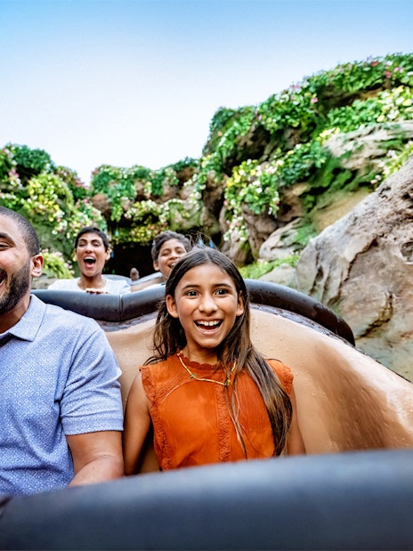 Guests enjoying a rollercoaster ride through lush jungle at Animal Kingdom, Walt Disney World, Orlando.