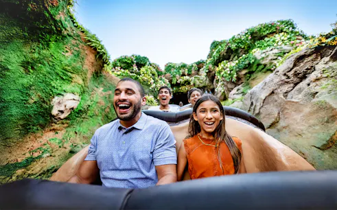 Guests enjoying a rollercoaster ride through lush jungle at Animal Kingdom, Walt Disney World, Orlando.