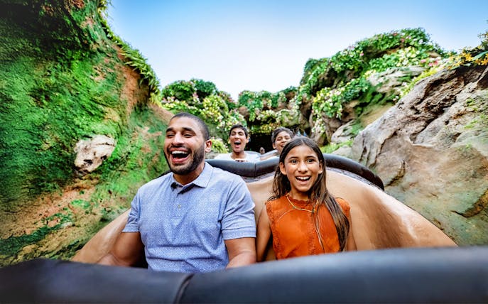 Guests enjoying a rollercoaster ride through lush jungle at Animal Kingdom, Walt Disney World, Orlando.