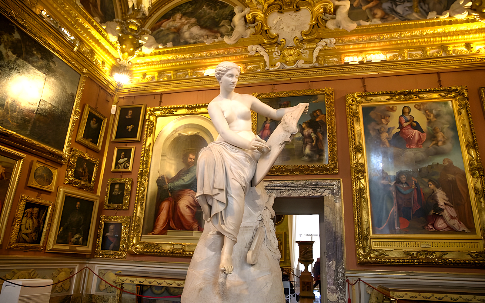 Palazzo Pitti interior with classical statue and Renaissance paintings, Florence.
