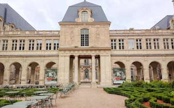 Carnavalet Museum courtyard with historic architecture and garden in Paris.