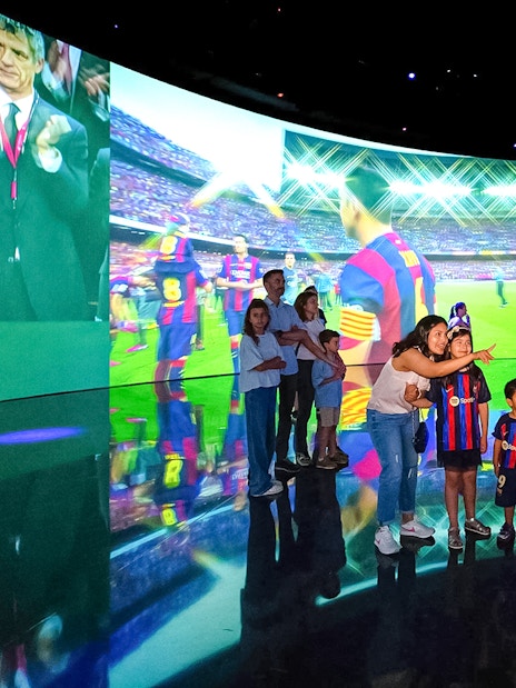 Visitors exploring interactive displays at the Spotify Camp Nou Barça Museum.