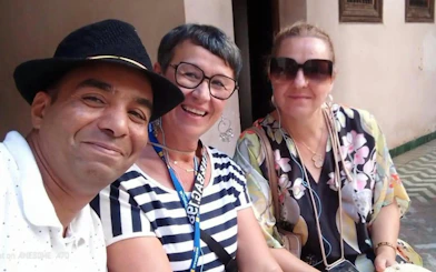 Tourists enjoying Fes city tour near Royal Palace, Morocco.