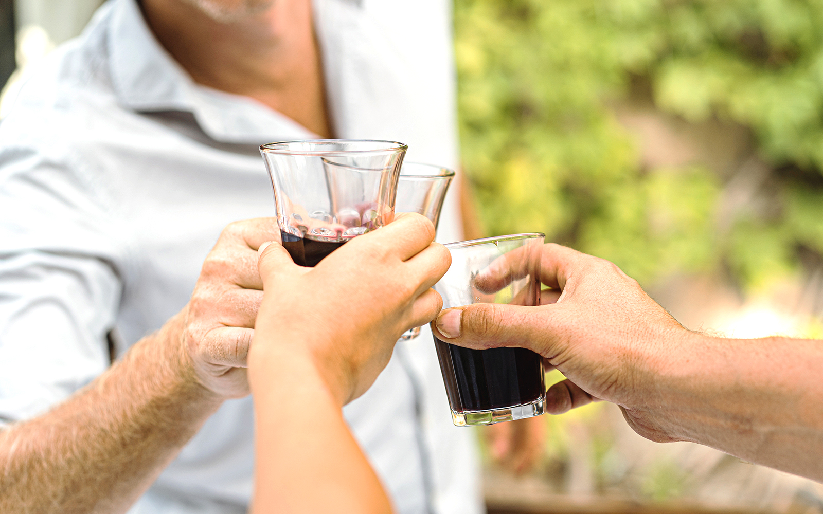 Mount Etna vineyard with wine barrels and scenic Sicilian landscape.