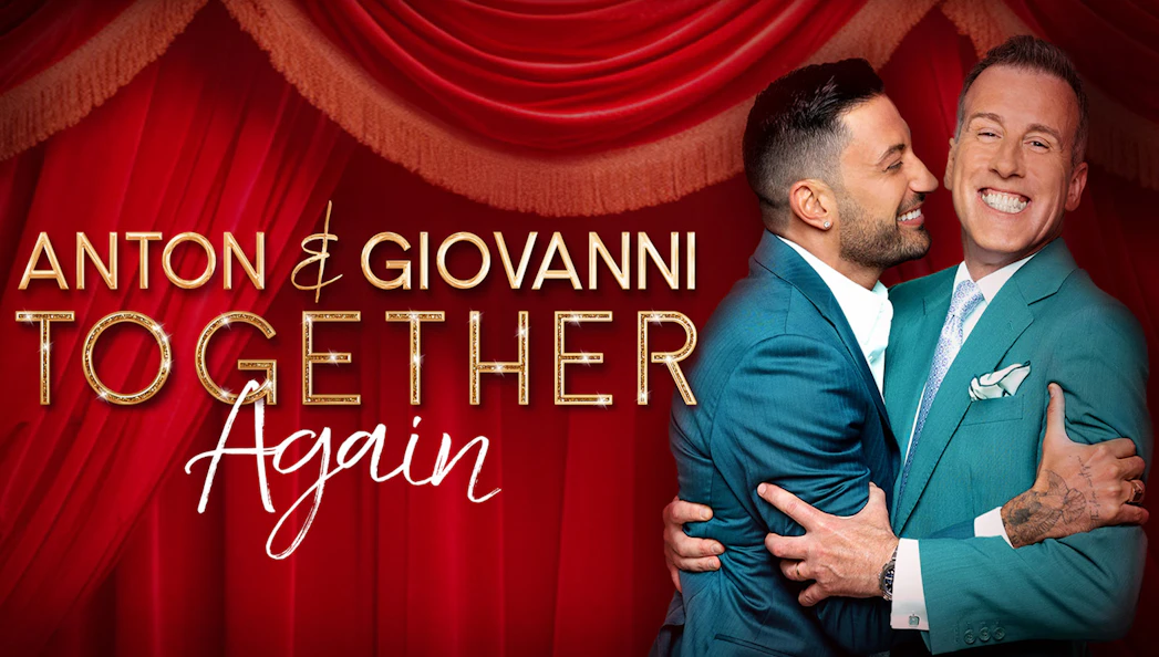 Anton and Giovanni embracing in front of red stage curtains for "Together Again" show.