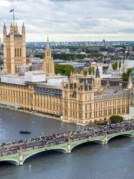 Big Ben under construction, Houses of Parliament, and Westminster Bridge viewed from the London Eye, London, UK.