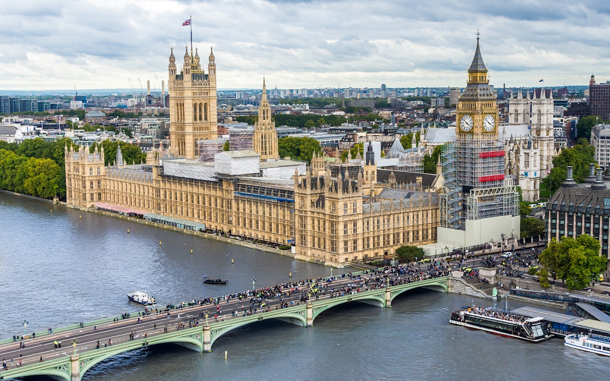 Big Ben under construction, Houses of Parliament, and Westminster Bridge viewed from the London Eye, London, UK.