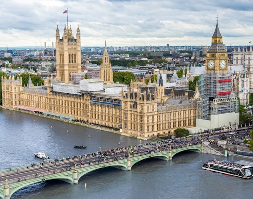 Big Ben under construction, Houses of Parliament, and Westminster Bridge viewed from the London Eye, London, UK.