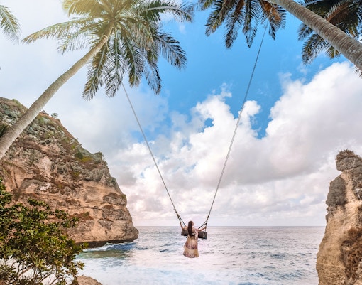 Tourists enjoying the scenic view of East/West/South Nusa Penida Island during an Instagrammable Private Tour with Hotel Transfers